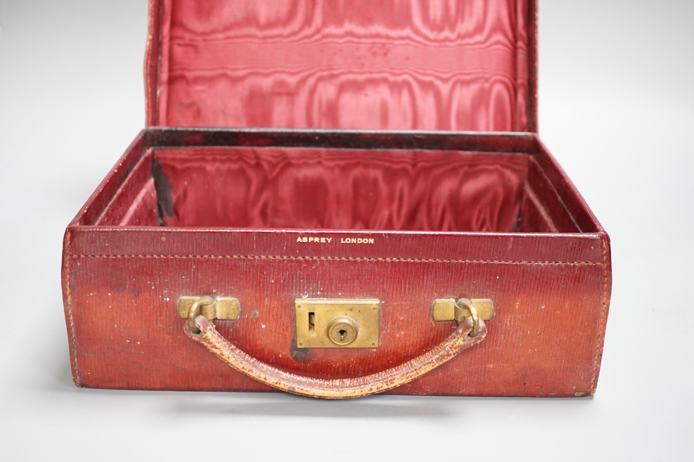 A Vintage Asprey red leather case, 28cm